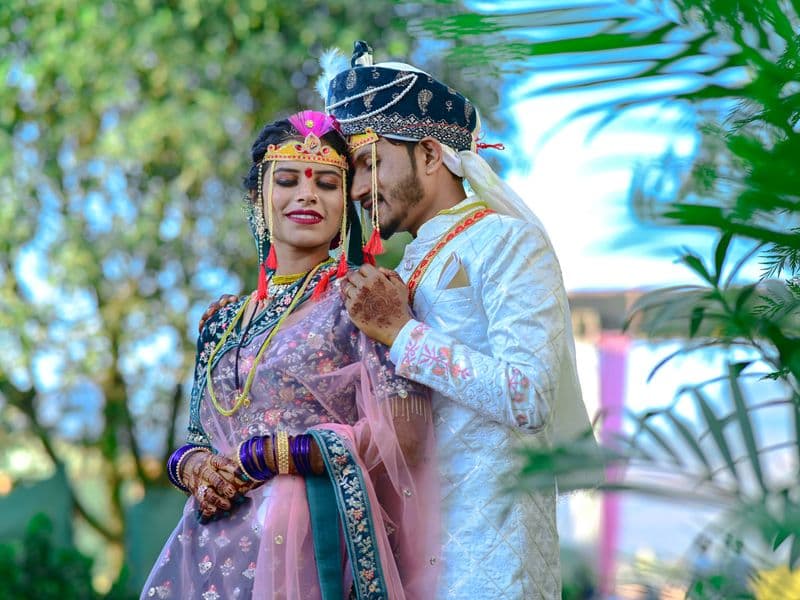 A couple in traditional Indian wedding dress