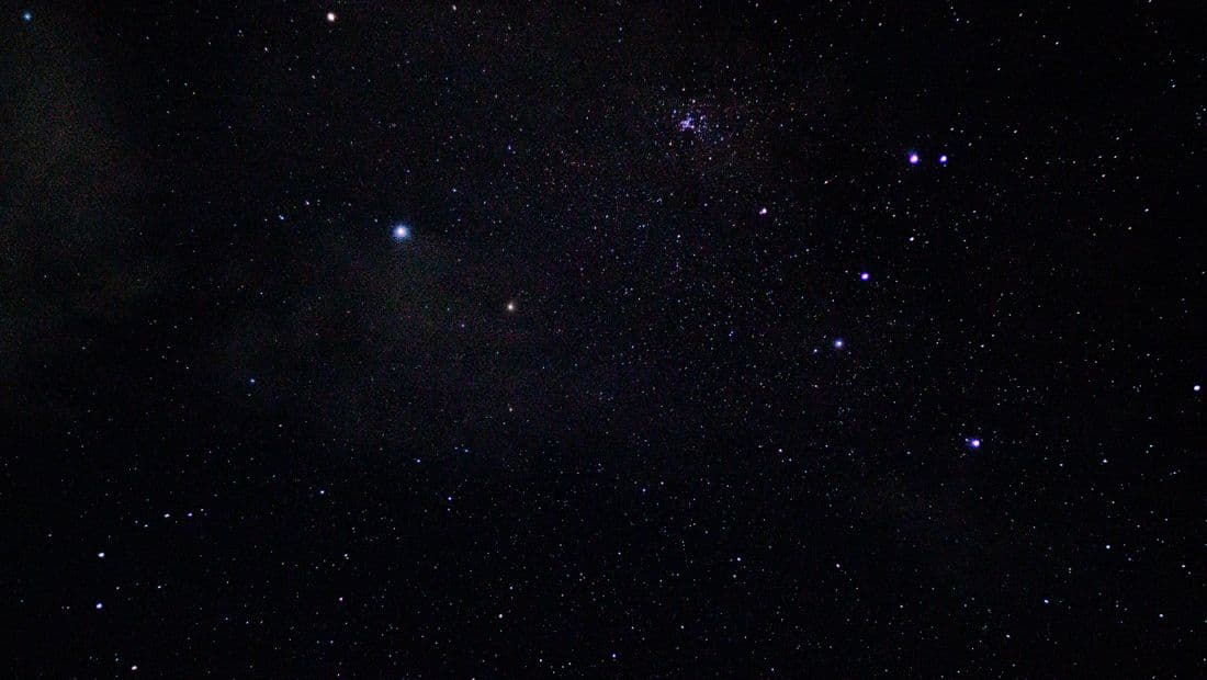 A clear night sky filled with stars and constellations